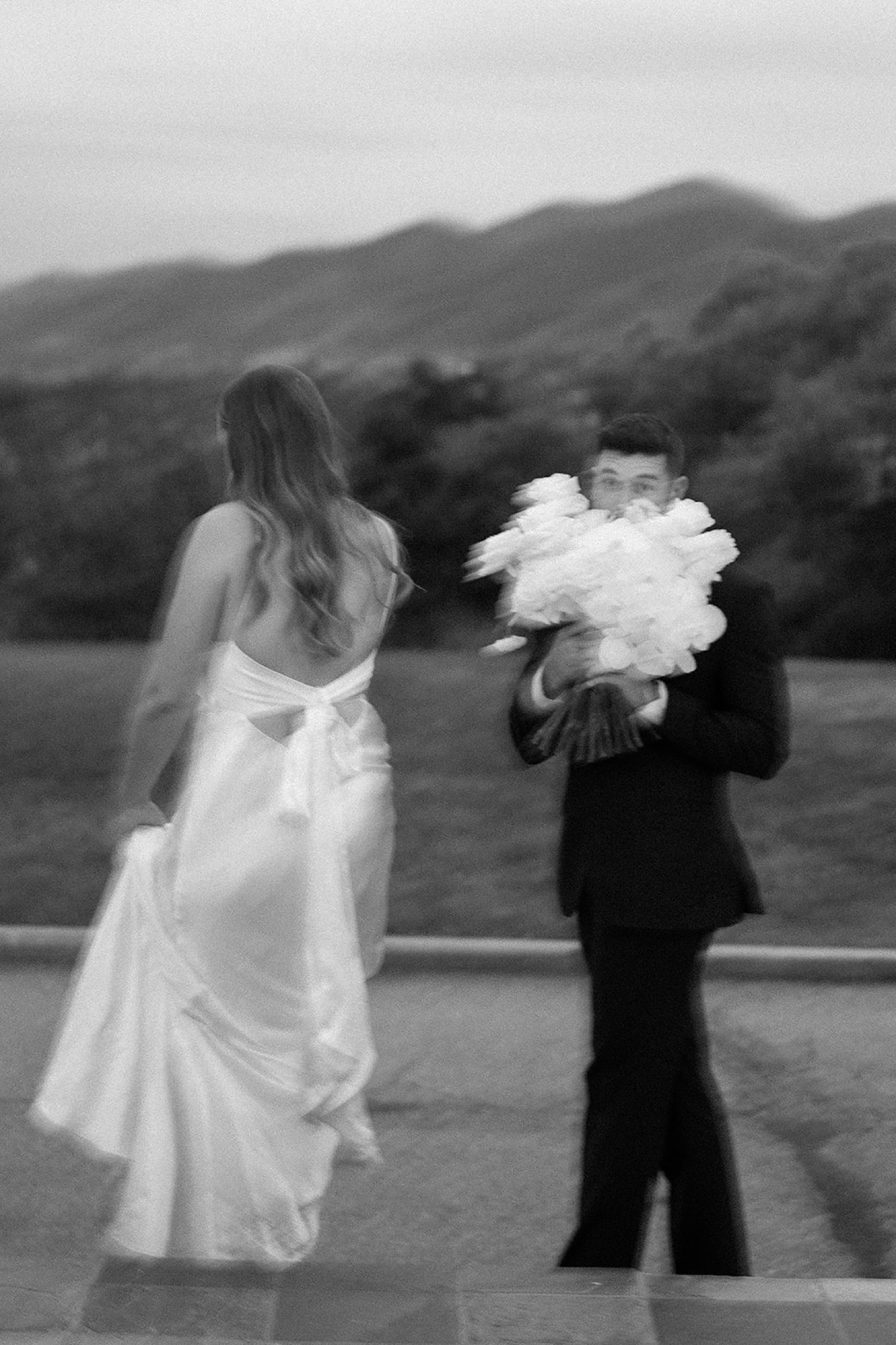 A candid blurry photo of a bride and groom