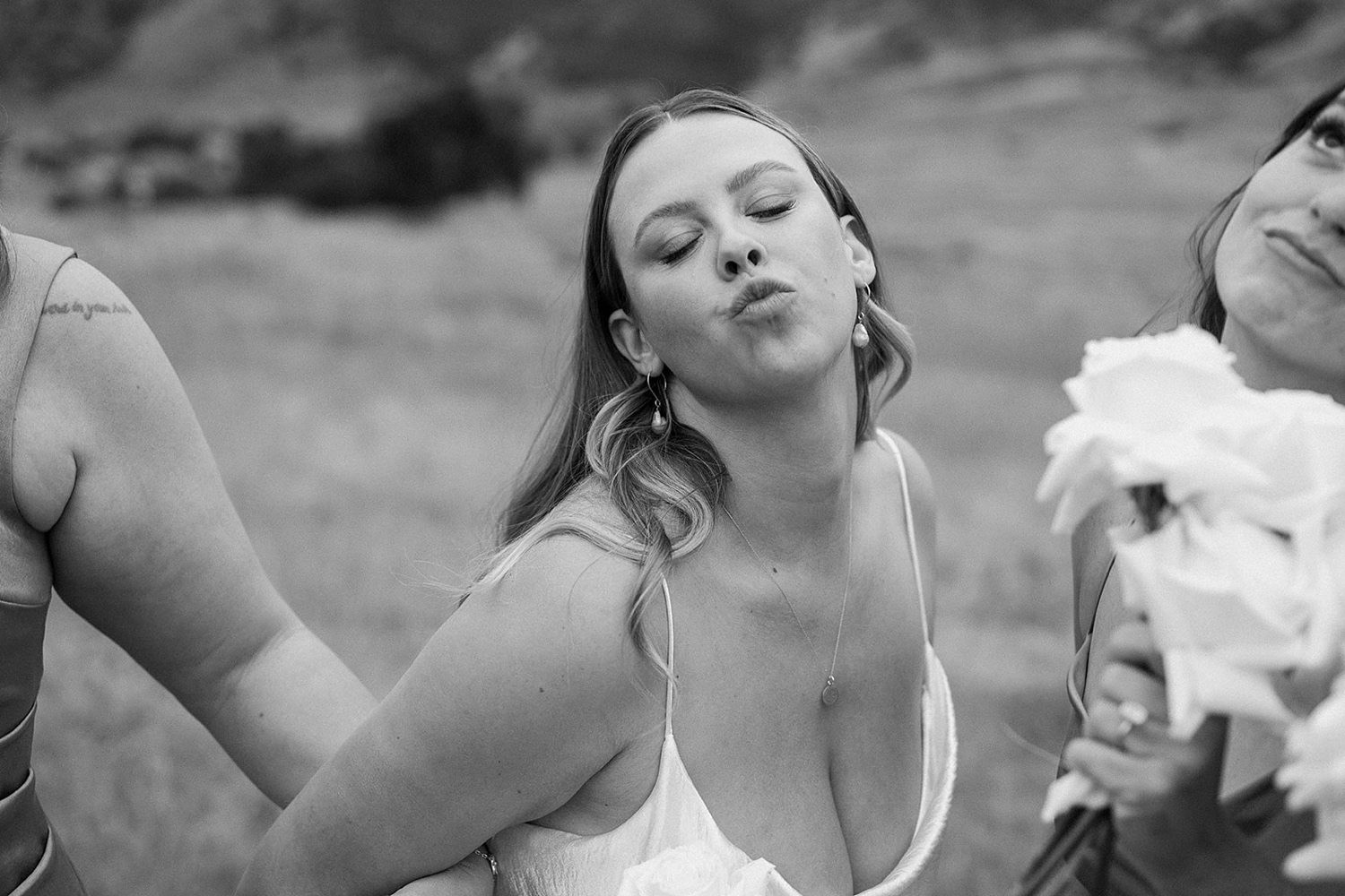 A bride making a kiss face for the camera