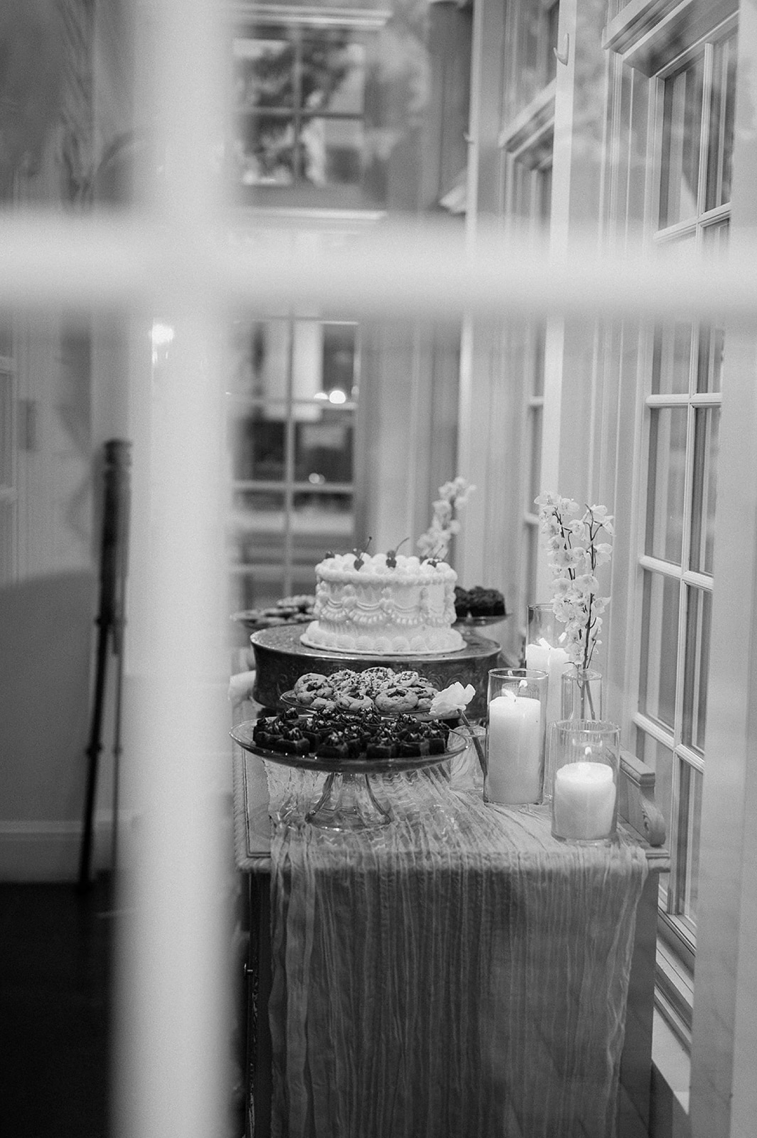 A vintage wedding cake sits on a table