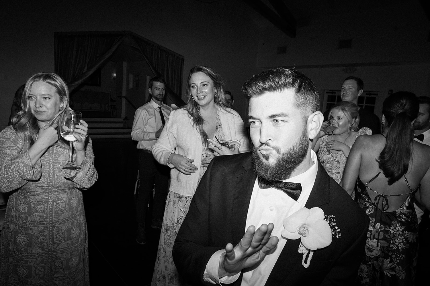 Groom dancing on the dance floor with his wedding guests