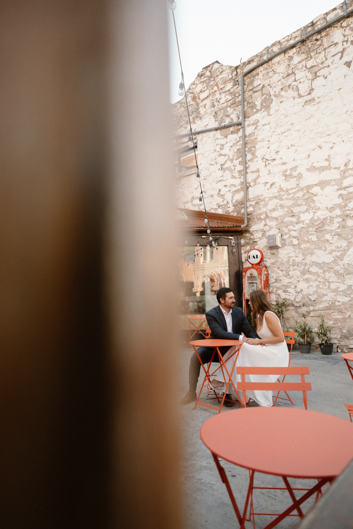 A couple poses for their Telluride engagement session in downtown Telluride, Colorado. Photo by Durango wedding photographer Ashley Joyce