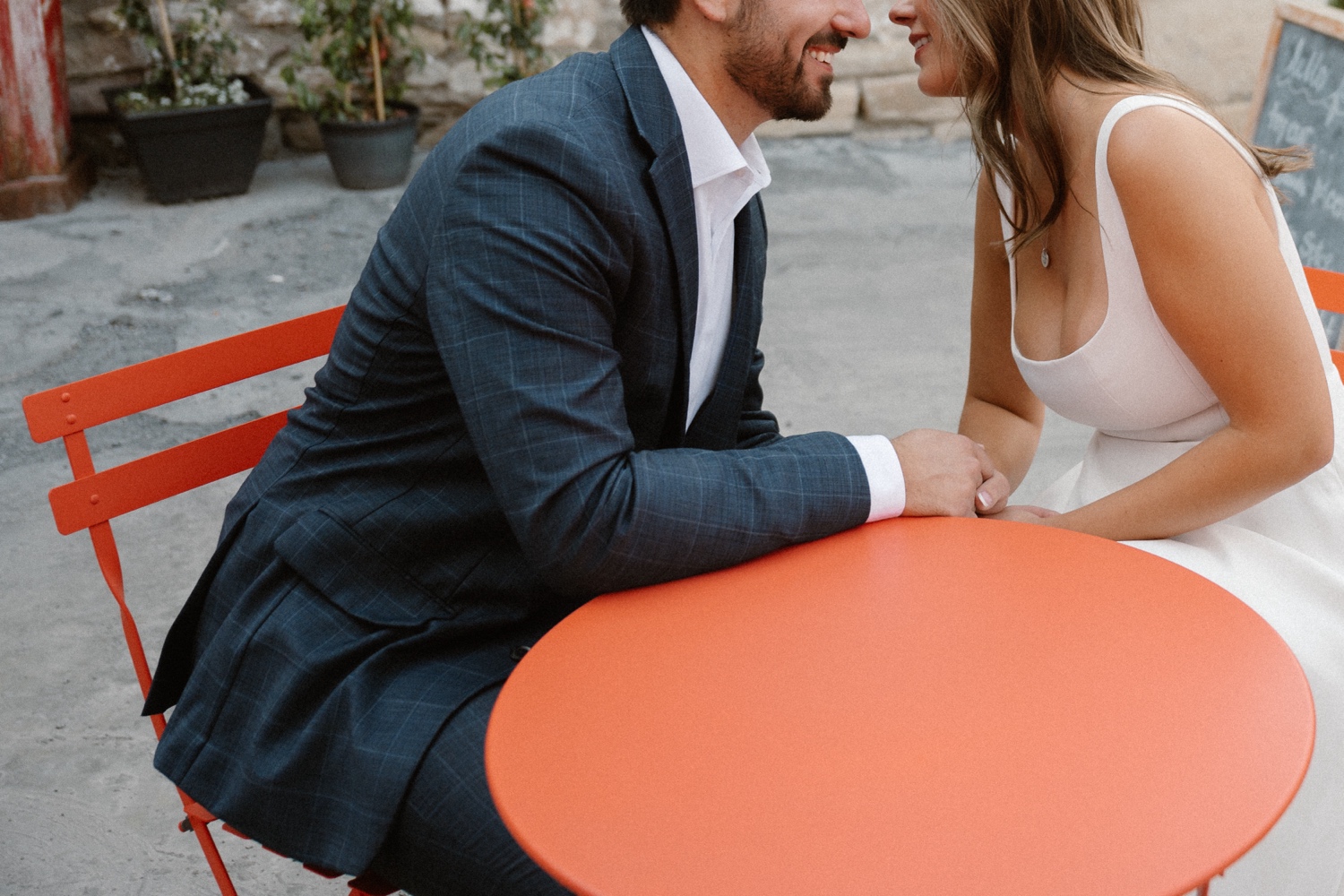 A couple poses for their Telluride engagement session in downtown Telluride, Colorado. Photo by Durango wedding photographer Ashley Joyce