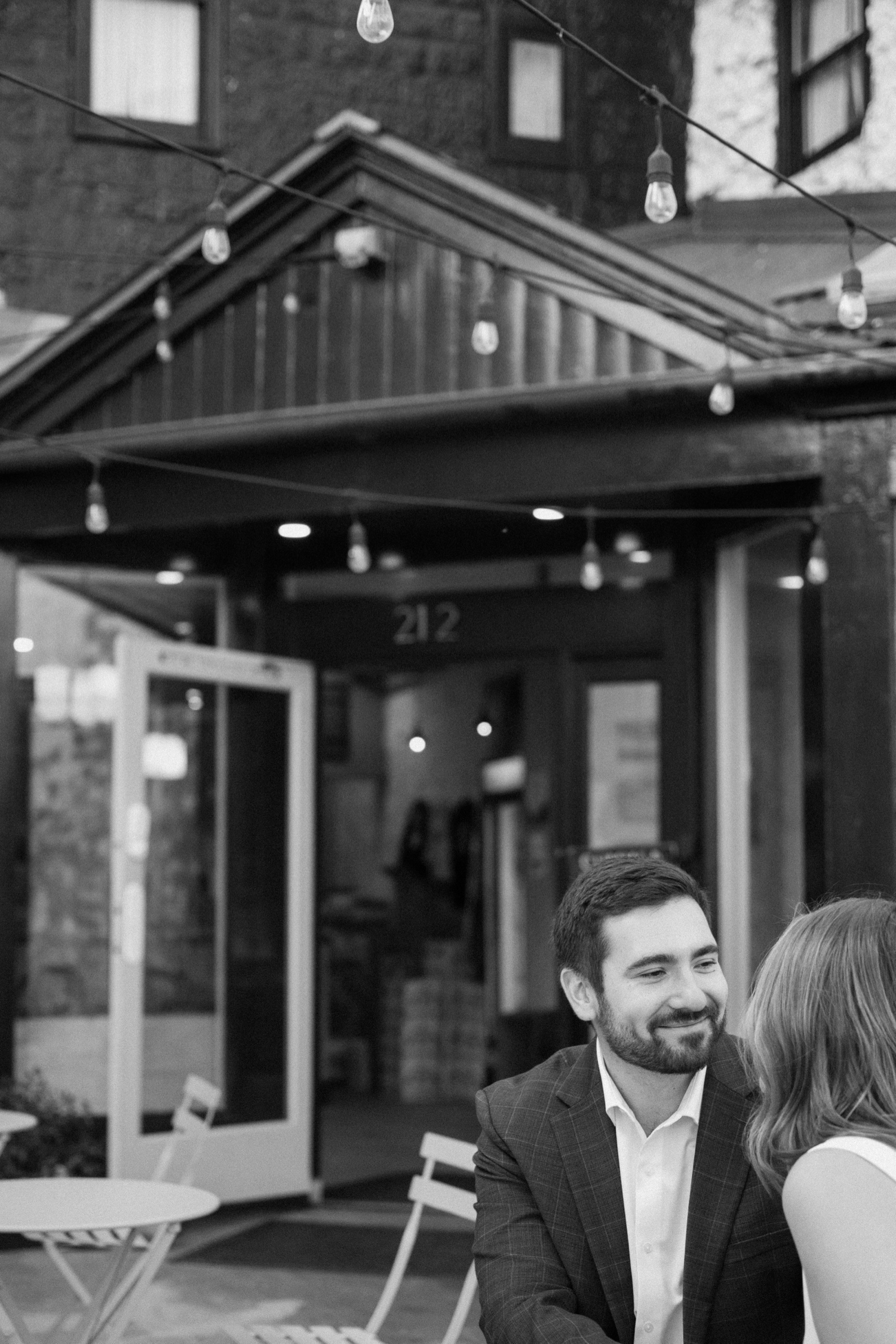 A couple poses for their Telluride engagement session in downtown Telluride, Colorado. Photo by Durango wedding photographer Ashley Joyce