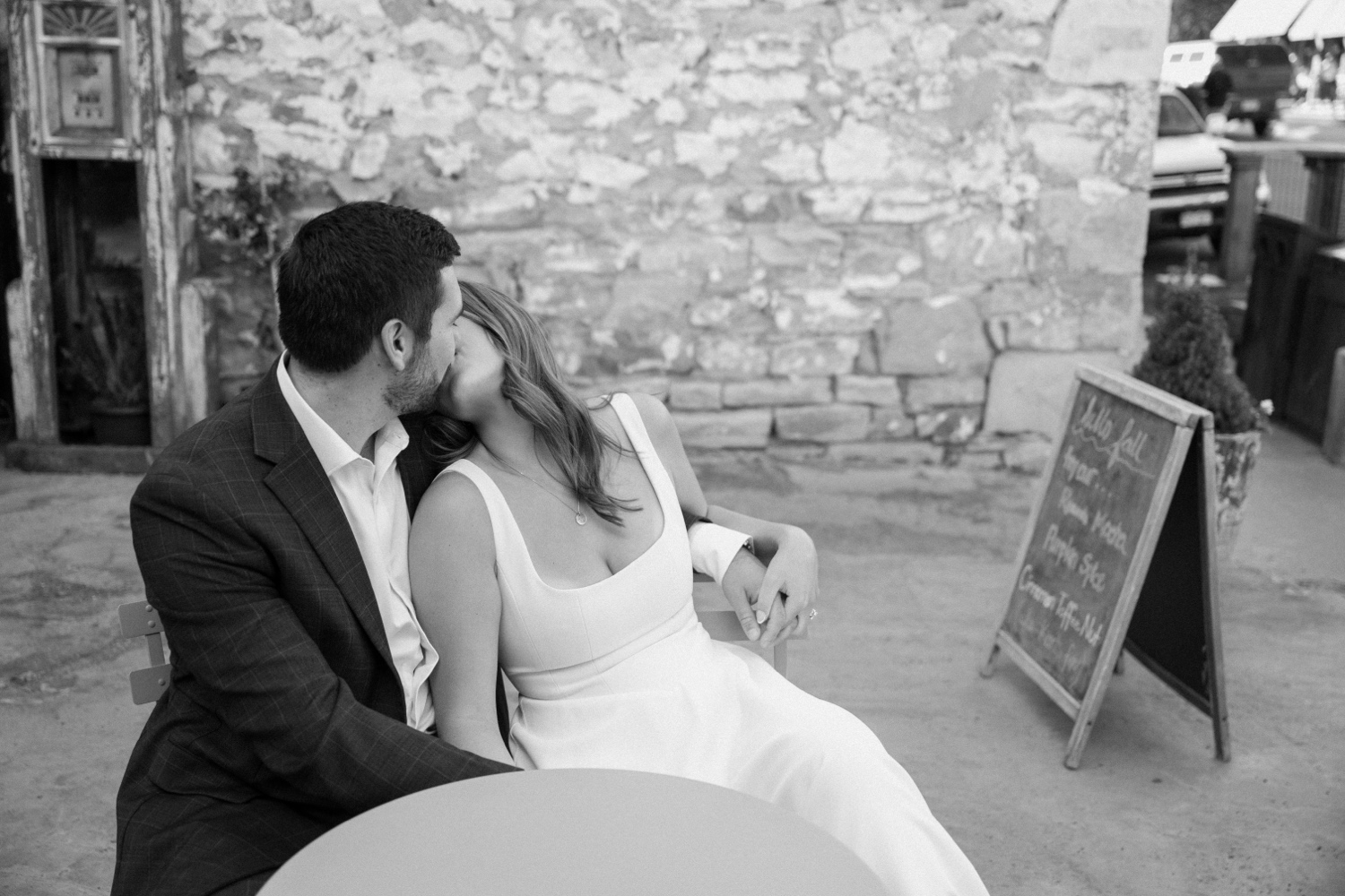 A couple poses for their Telluride engagement session in downtown Telluride, Colorado. Photo by Durango wedding photographer Ashley Joyce