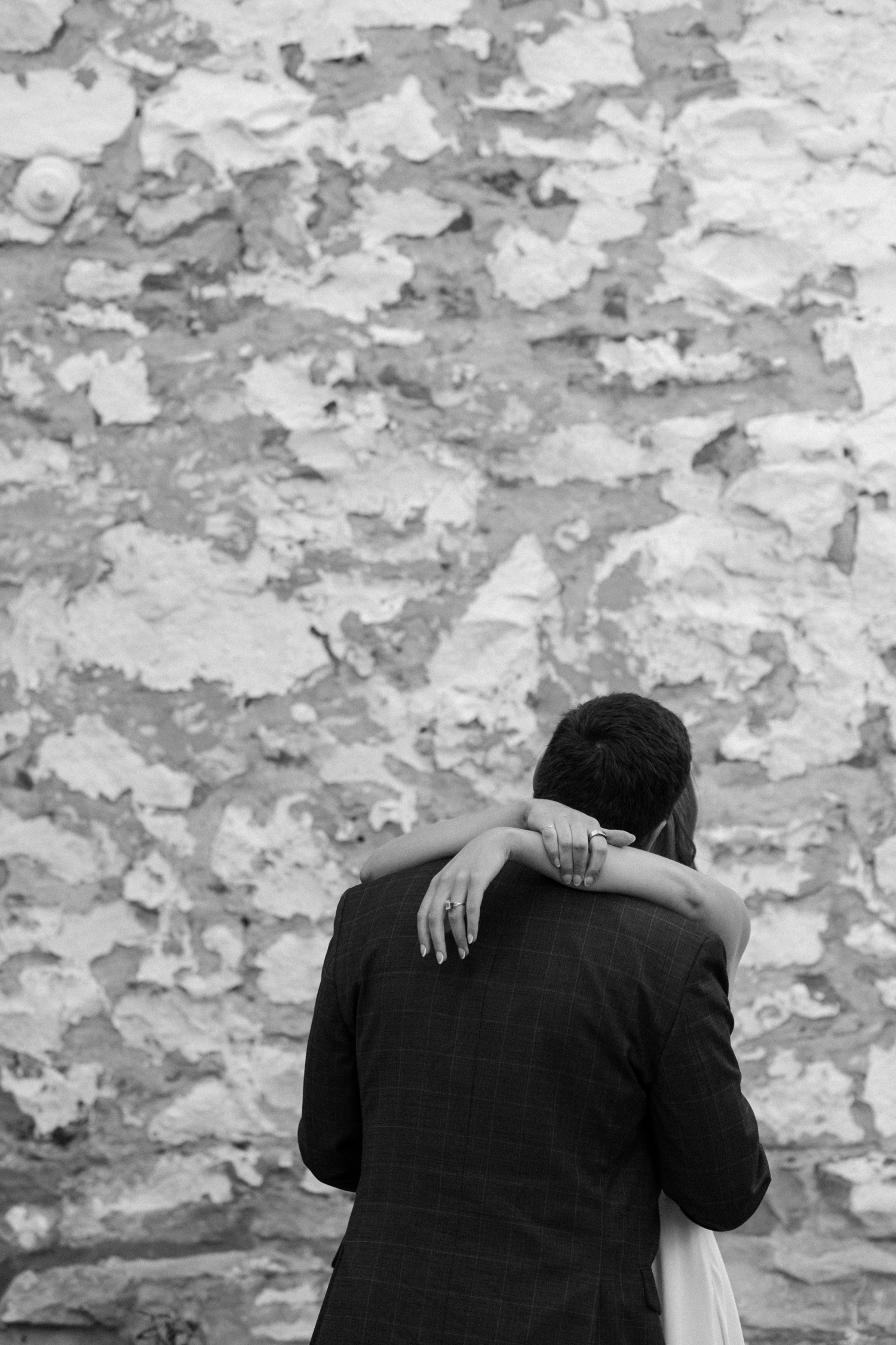 A couple poses for their Telluride engagement session in downtown Telluride, Colorado. Photo by Durango wedding photographer Ashley Joyce