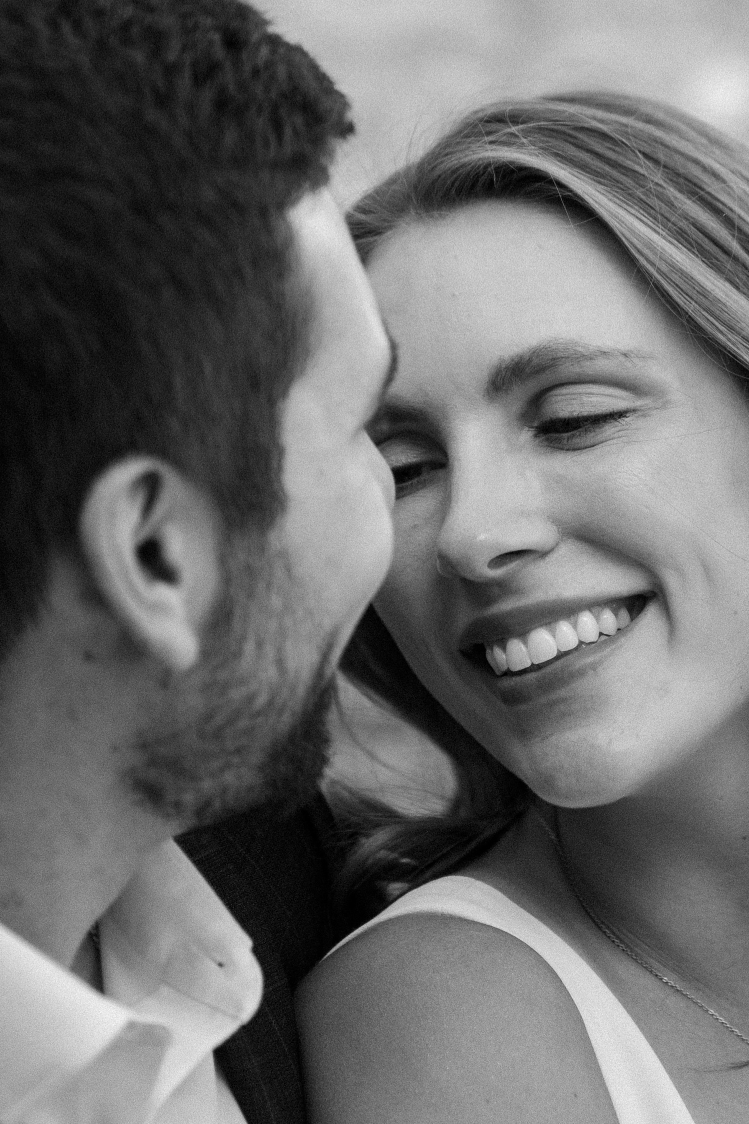 A couple poses for their Telluride engagement session in downtown Telluride, Colorado. Photo by Durango wedding photographer Ashley Joyce