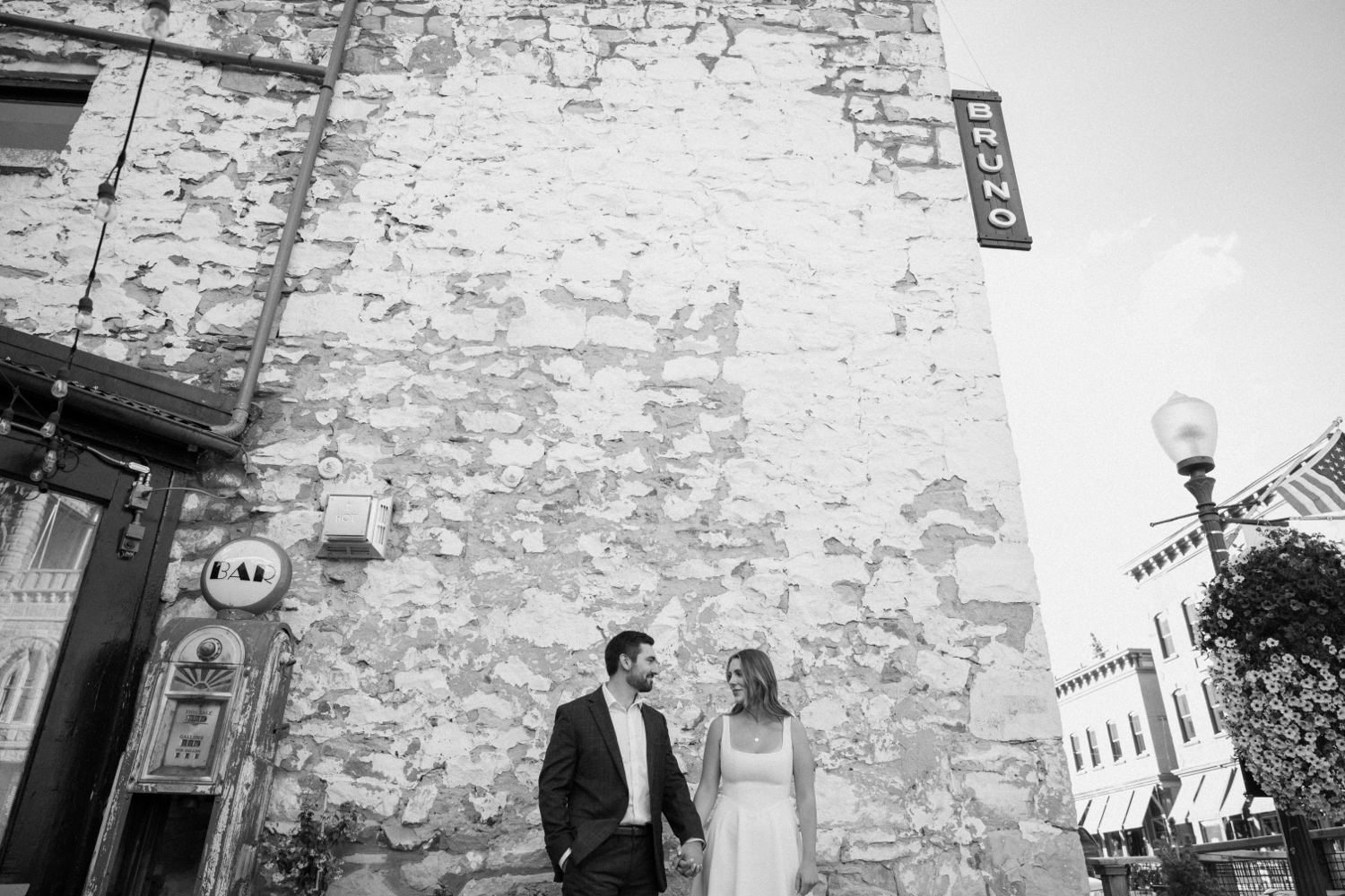 A couple poses for their Telluride engagement session in downtown Telluride, Colorado. Photo by Durango wedding photographer Ashley Joyce