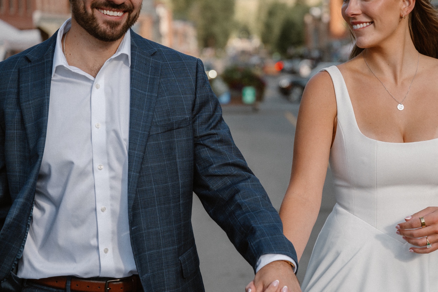 A couple poses for their Telluride engagement session in downtown Telluride, Colorado. Photo by Durango wedding photographer Ashley Joyce