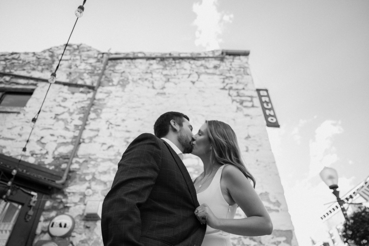 A couple poses for their Telluride engagement session in downtown Telluride, Colorado. Photo by Durango wedding photographer Ashley Joyce