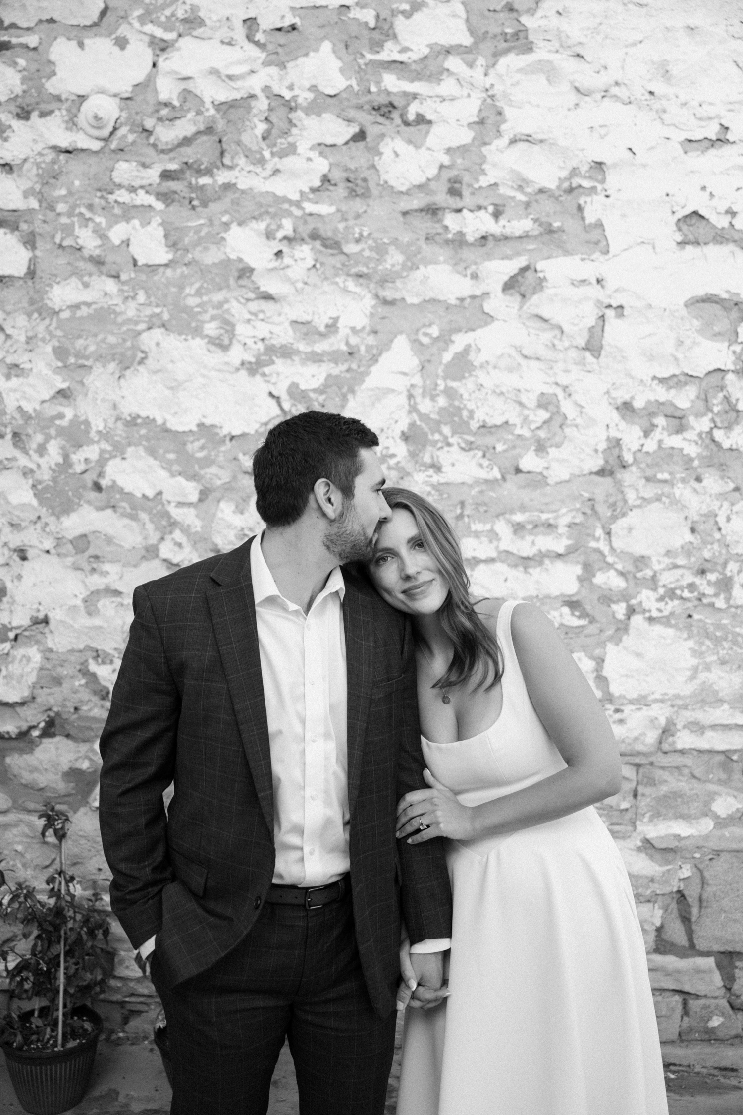 A couple poses for their Telluride engagement session in downtown Telluride, Colorado. Photo by Durango wedding photographer Ashley Joyce