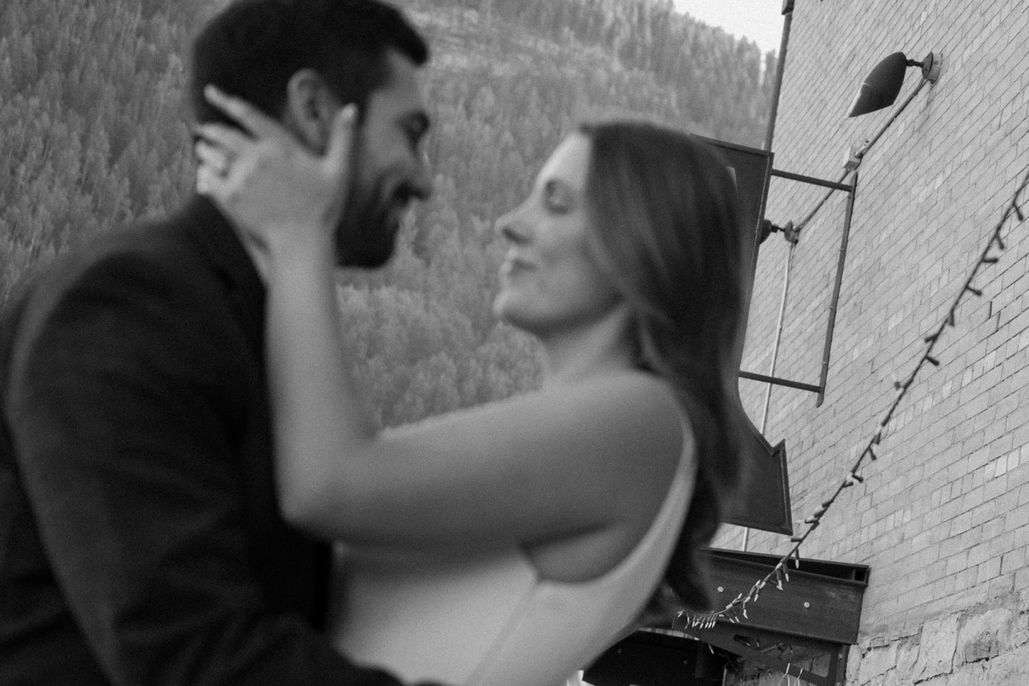 A couple poses for their Telluride engagement session in downtown Telluride, Colorado. Photo by Durango wedding photographer Ashley Joyce