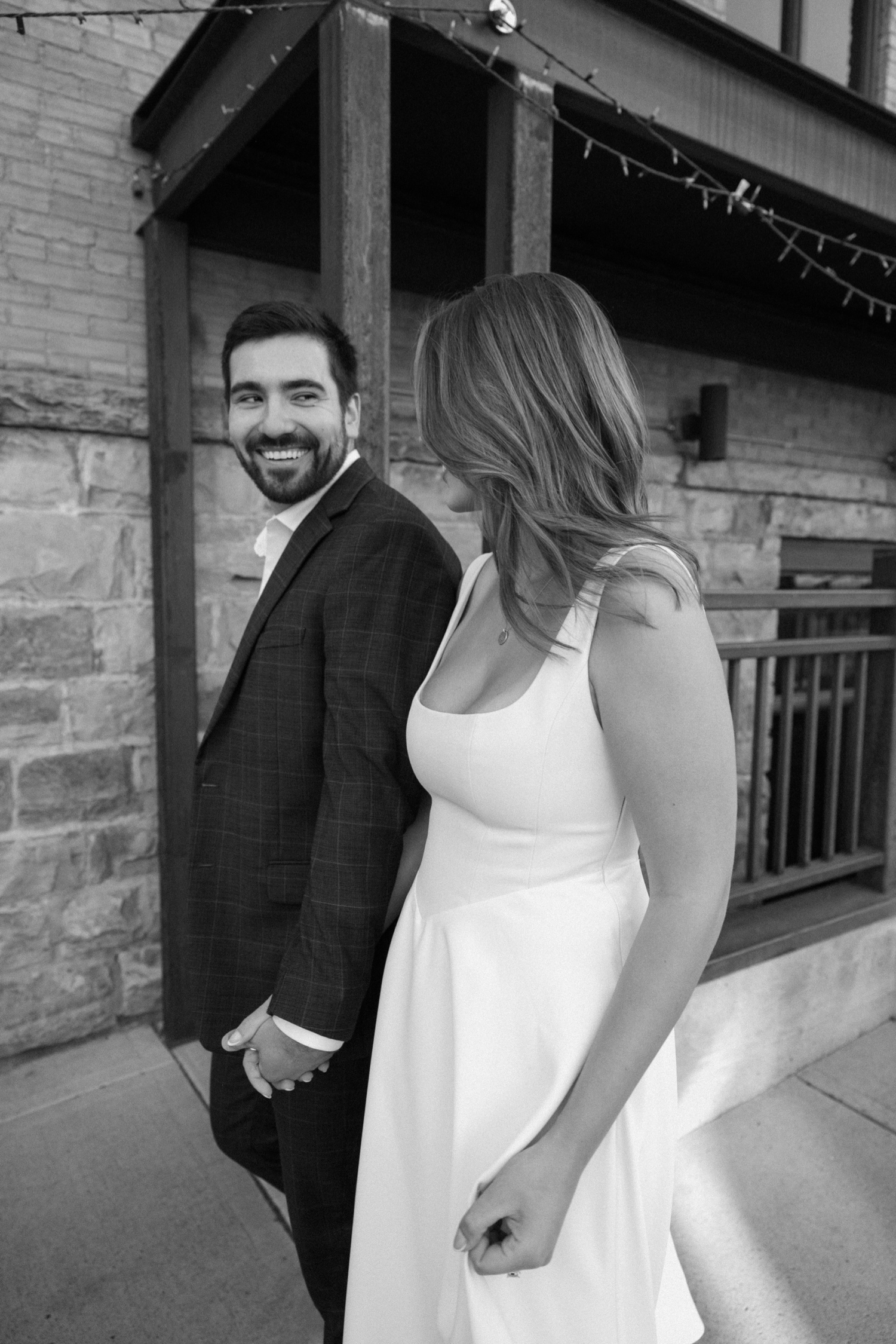 A couple poses for their Telluride engagement session in downtown Telluride, Colorado. Photo by Durango wedding photographer Ashley Joyce