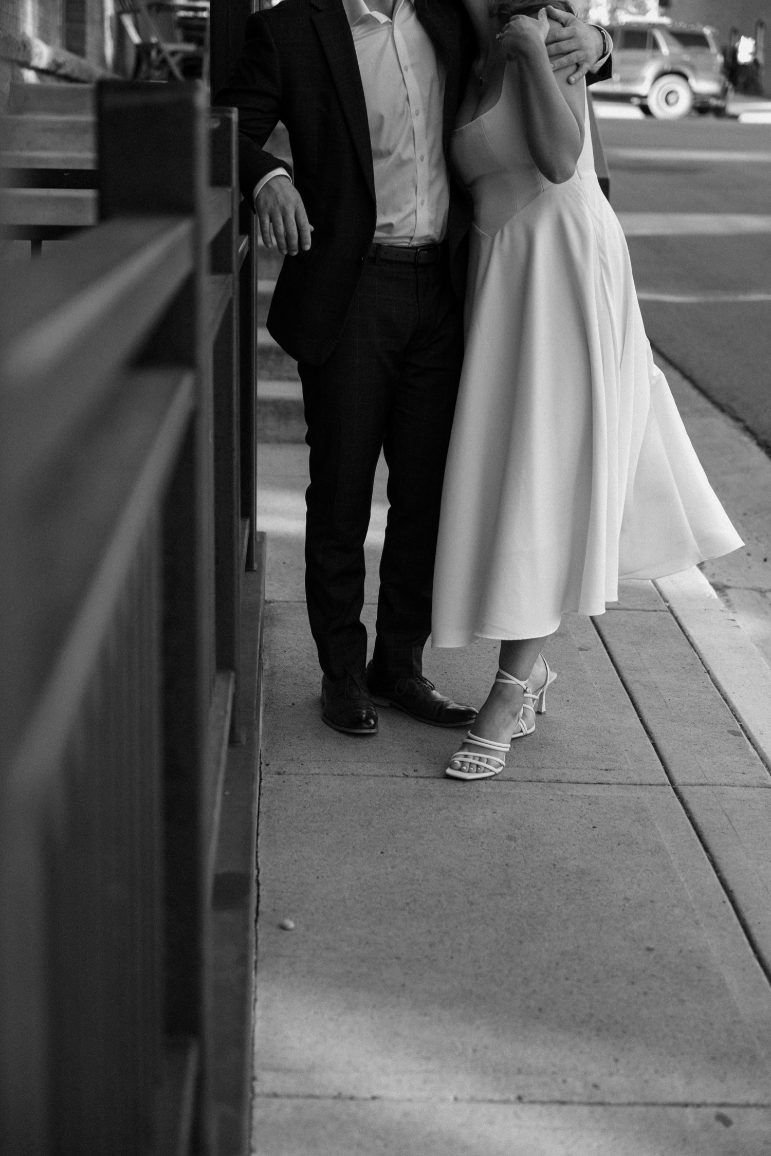 A couple poses for their Telluride engagement session in downtown Telluride, Colorado. Photo by Durango wedding photographer Ashley Joyce