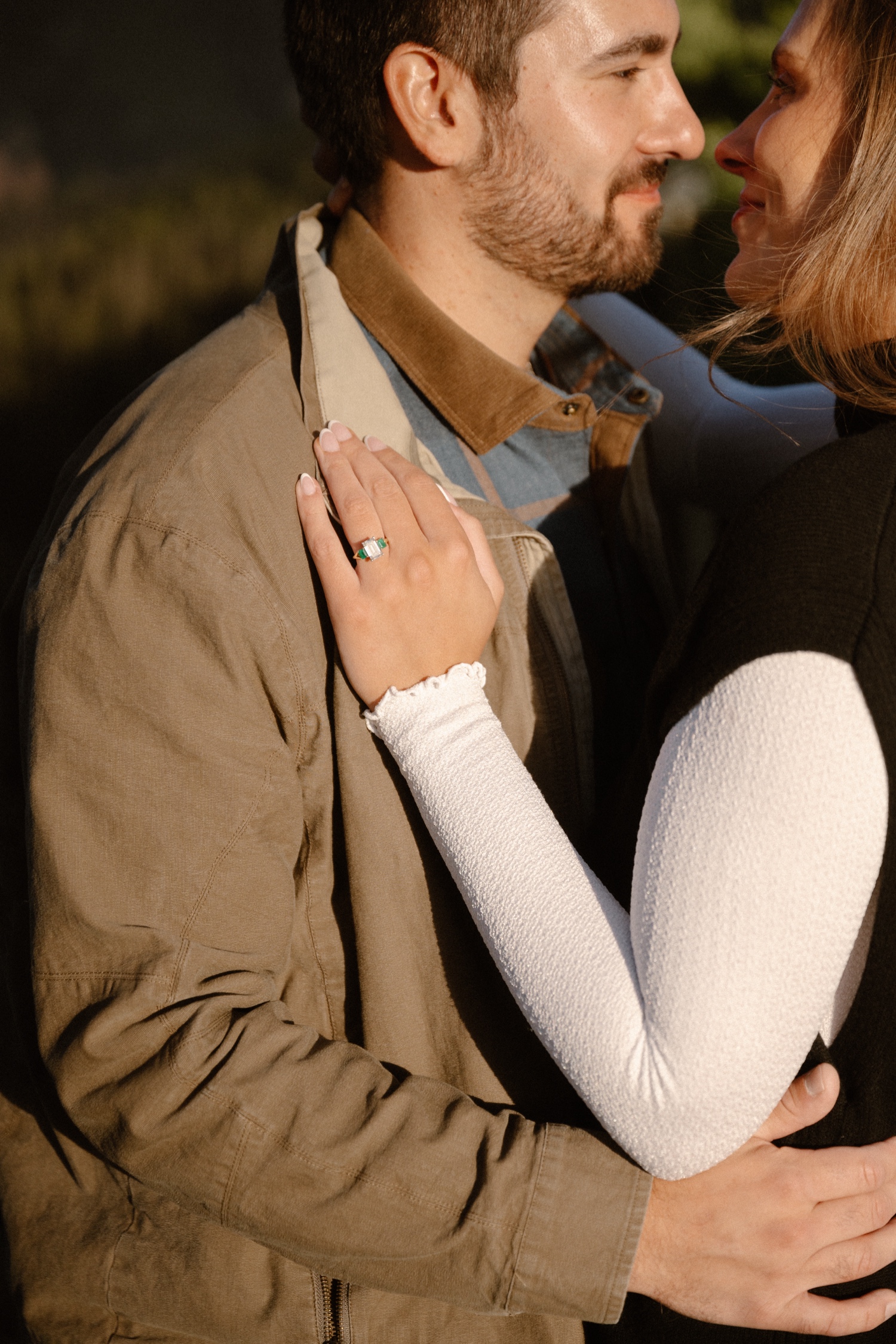 A couple poses for their Telluride engagement session at San Sophia Overlook at the Telluride ski resort. Photo by Durango wedding photographer Ashley Joyce