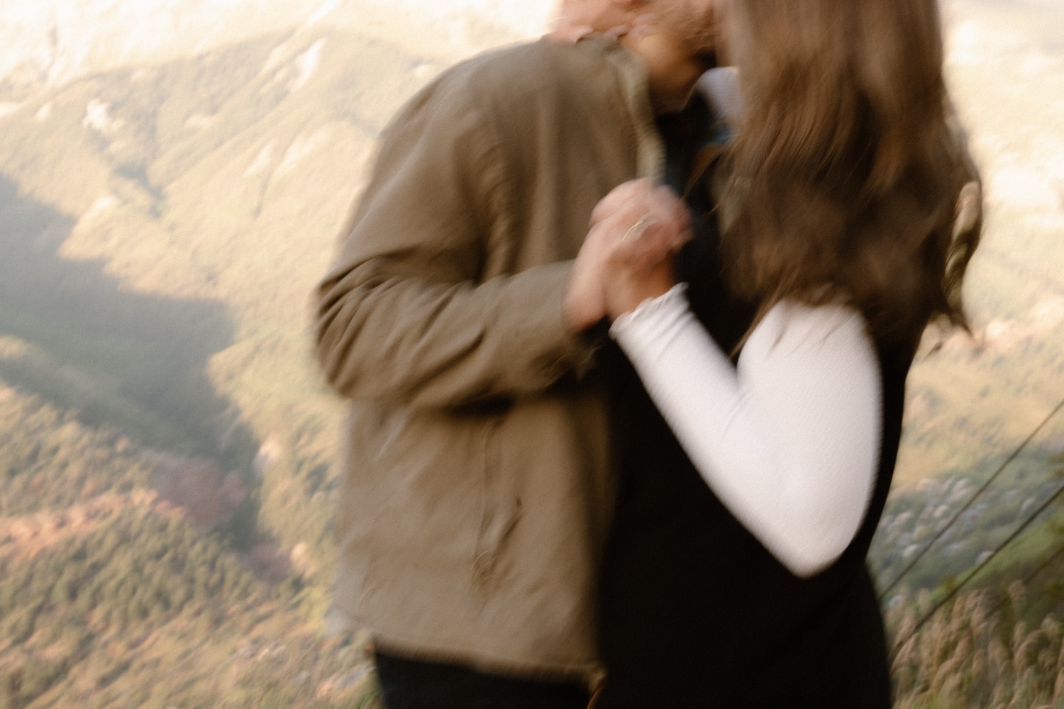 A couple poses for their Telluride engagement session at San Sophia Overlook at the Telluride ski resort. Photo by Durango wedding photographer Ashley Joyce