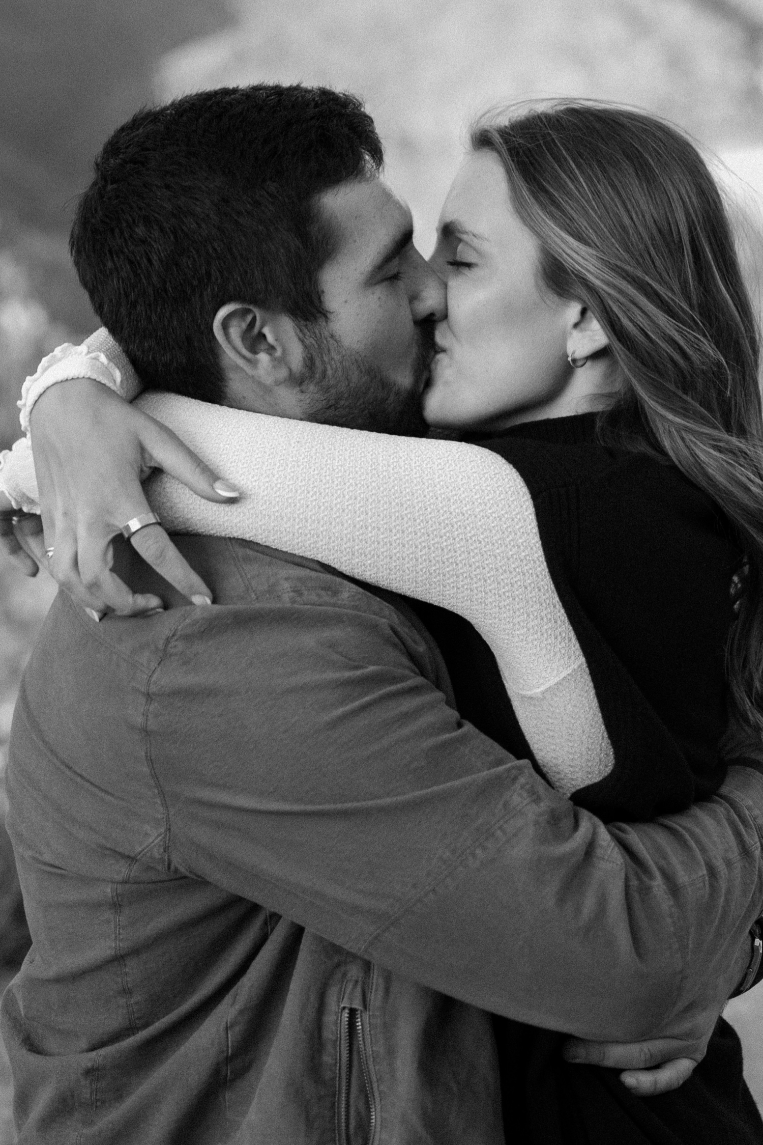 A couple poses for their Telluride engagement session at San Sophia Overlook at the Telluride ski resort. Photo by Durango wedding photographer Ashley Joyce