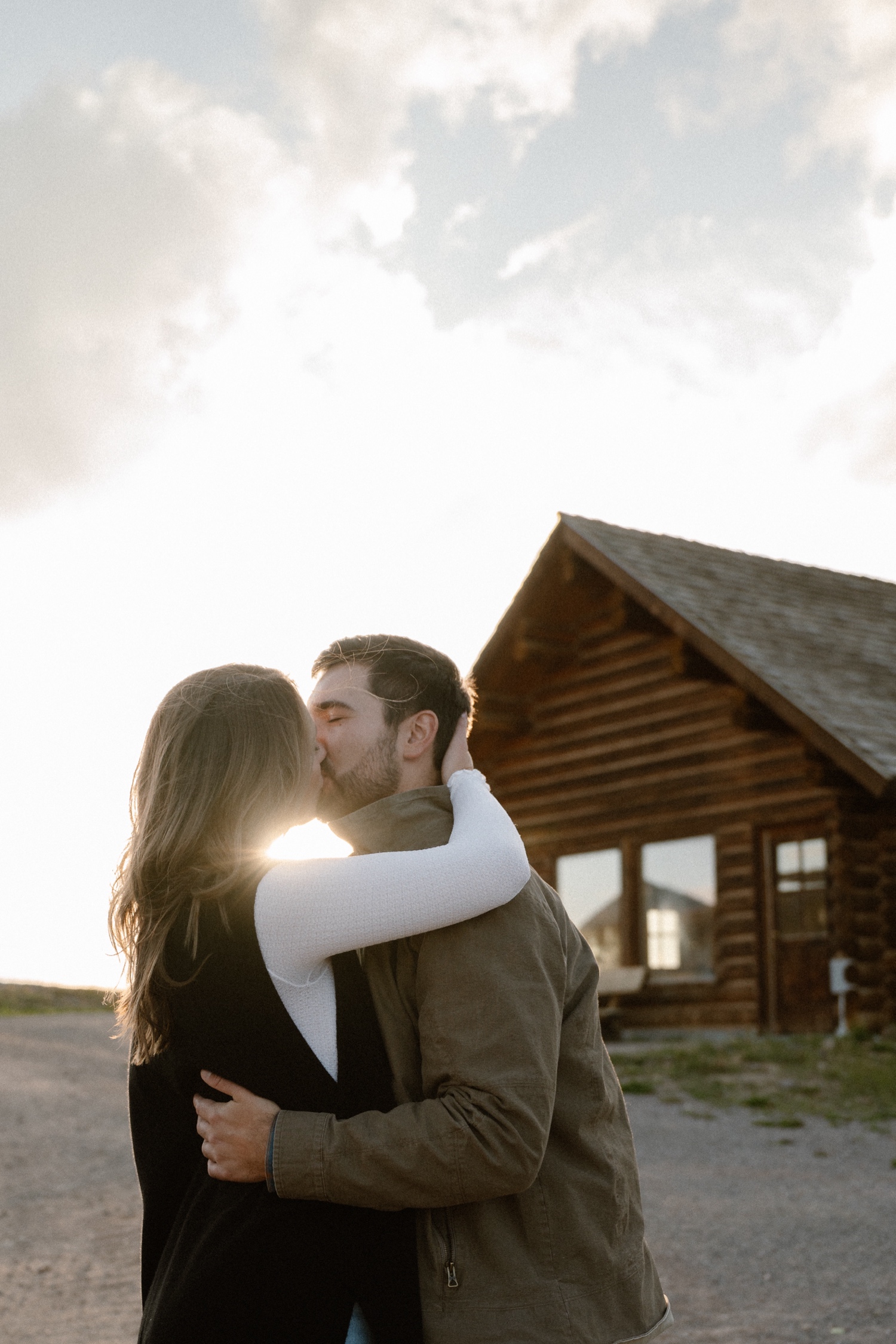 A couple poses for their Telluride engagement session at San Sophia Overlook at the Telluride ski resort. Photo by Durango wedding photographer Ashley Joyce