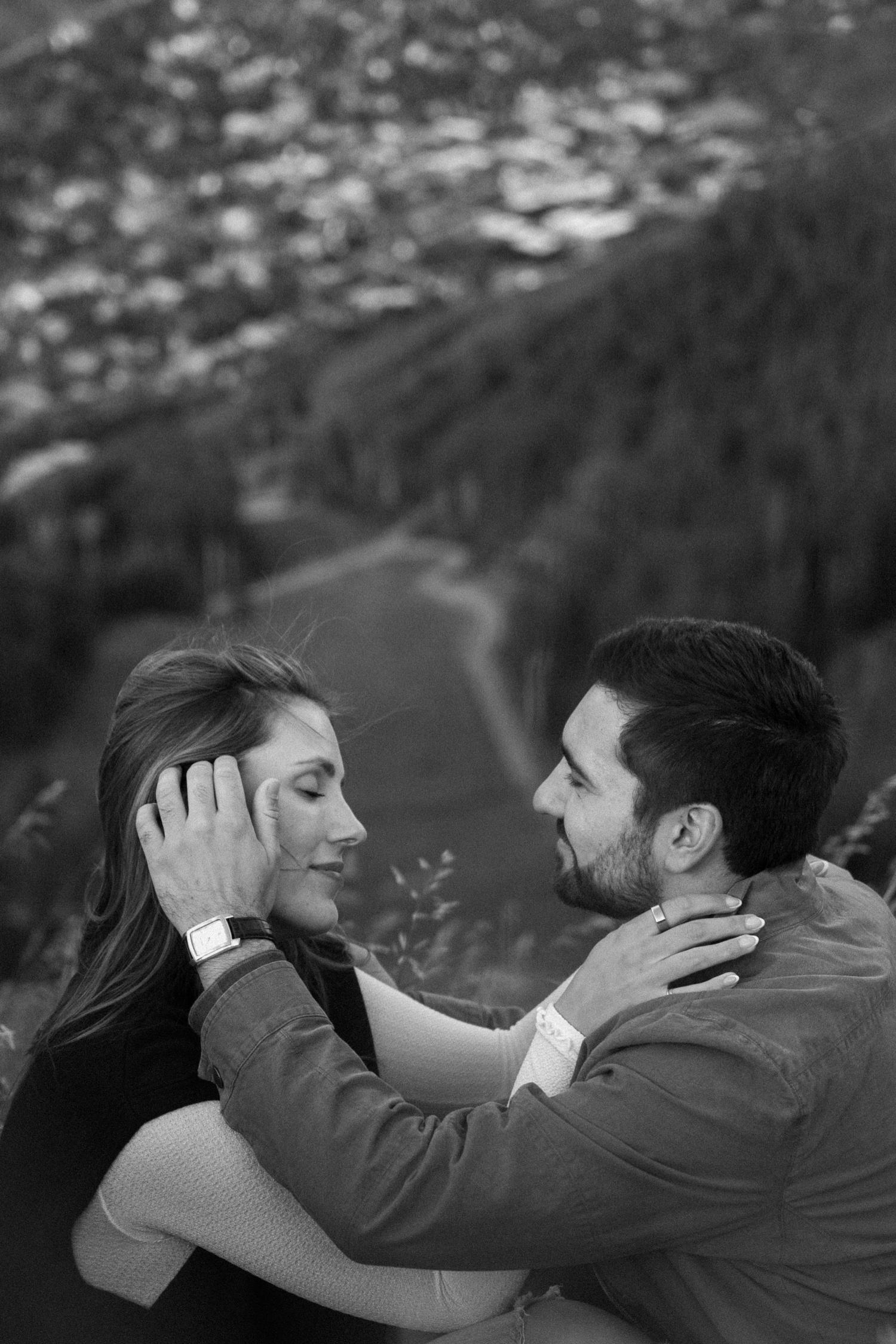 A couple poses for their Telluride engagement session at San Sophia Overlook at the Telluride ski resort. Photo by Durango wedding photographer Ashley Joyce