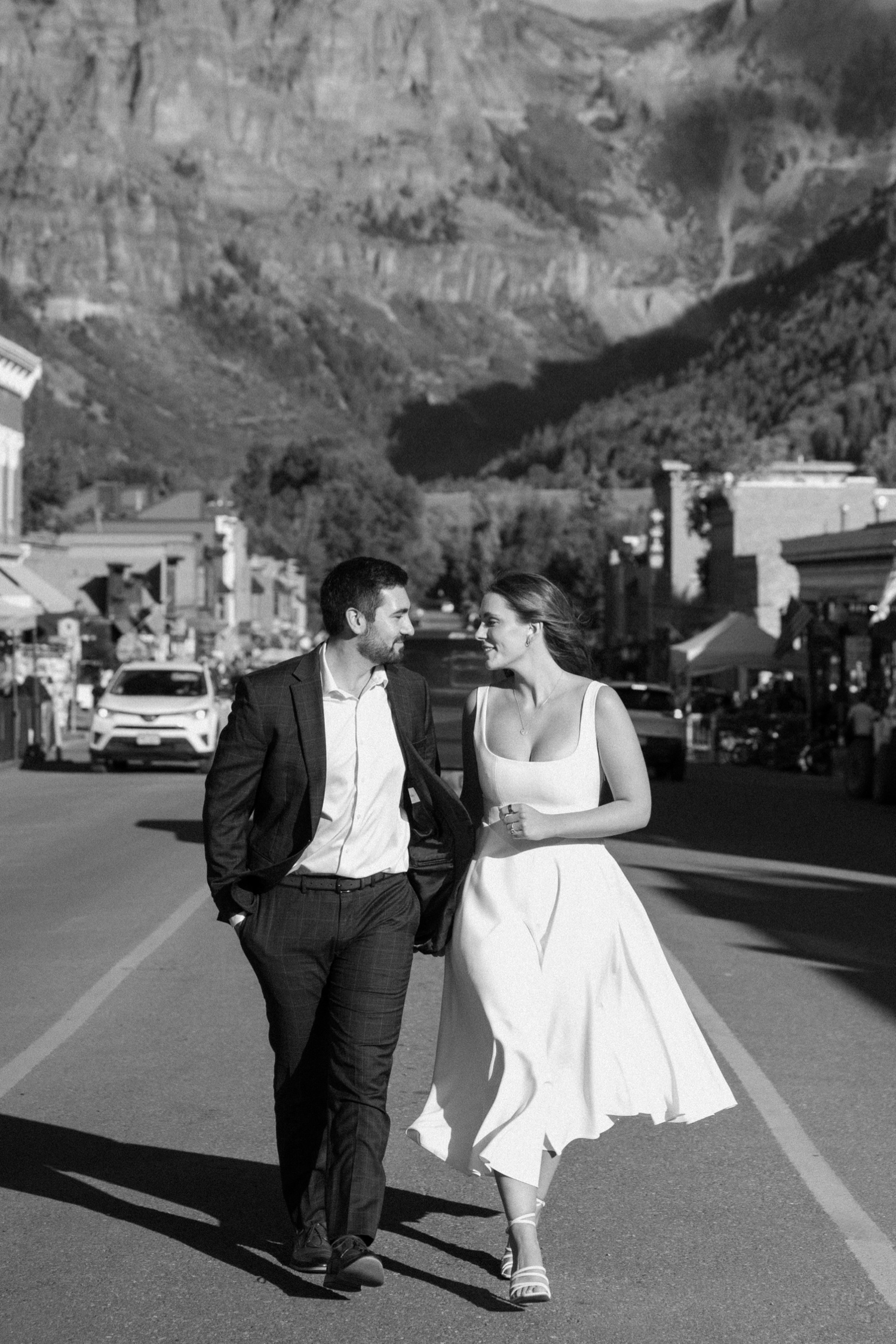 A couple poses for their Telluride engagement session in downtown Telluride, Colorado. Photo by Durango wedding photographer Ashley Joyce