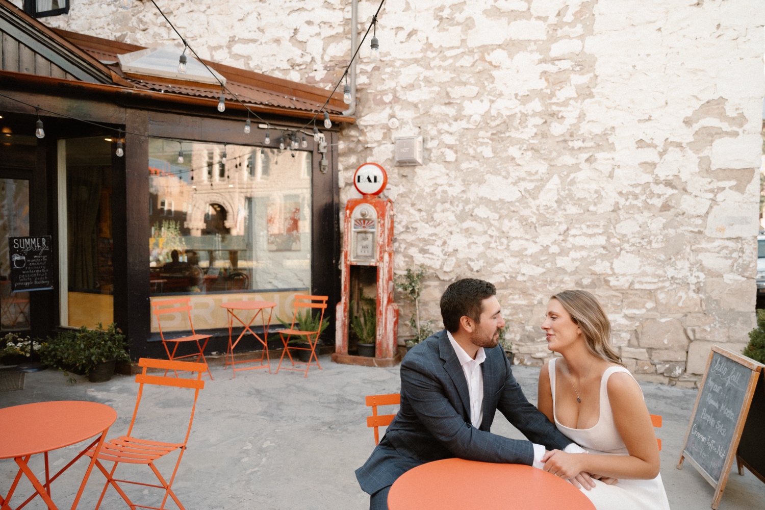 A couple poses for their Telluride engagement session in downtown Telluride, Colorado. Photo by Durango wedding photographer Ashley Joyce