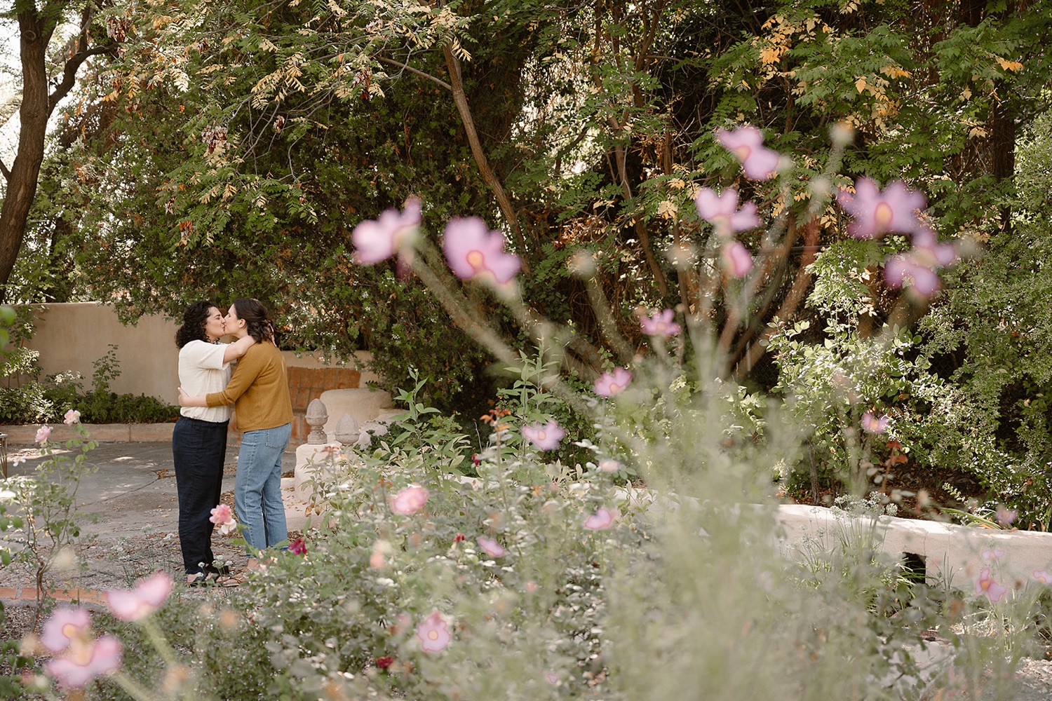 Fall foliage surrounding a couple during their engagement session at Los Poblanos Historic Inn and Lavender Farm.